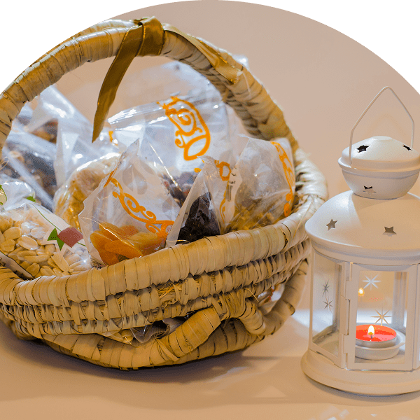 Basket with snacks and white lantern.
